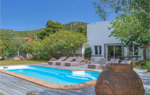 Four-Bedroom Holiday Home in Figari - main image