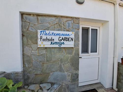 Mediterranean poolside garden cottage