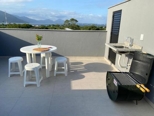 Studio com terraço com linda vista para Lagoa