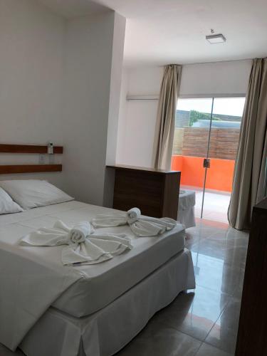Triple Room with Balcony room in HOTEL ENSEADA BEIRA MAR