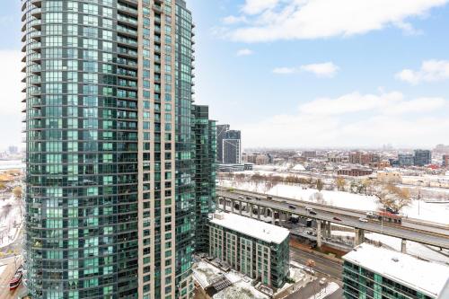 AOC Suites - High-Rise Condo - City View - Tap to explore photos