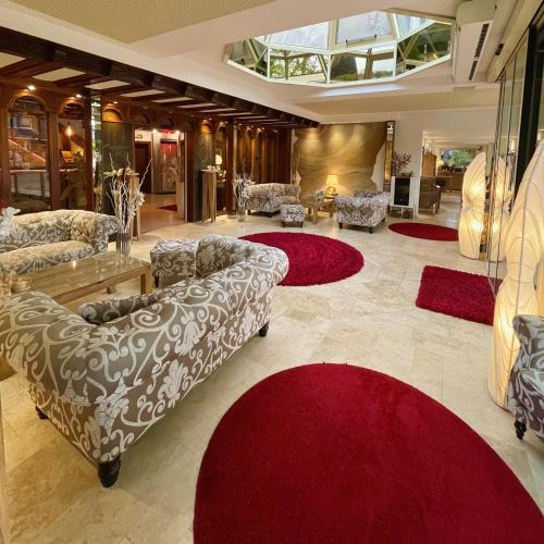 ห้องส่วนกลางสำหรับนั่งเล่น/ดูทีวี, Villa am Park in บาด สวิสเชนอาน