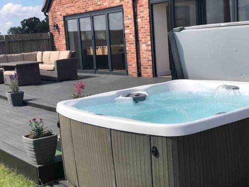 Barn Conversion with Hot Tub & Beautiful Views sleeps 12