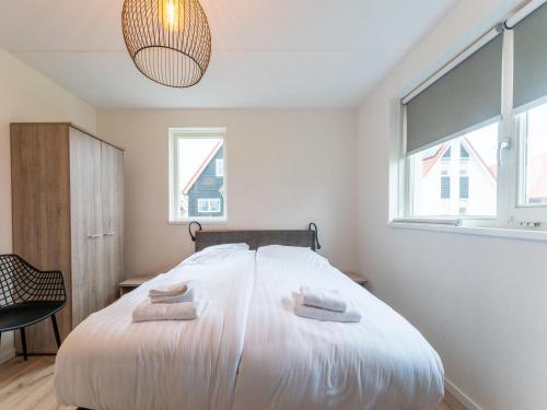 Guestroom, Modern vacation home by the sea with covered terrace and sauna in Tholen