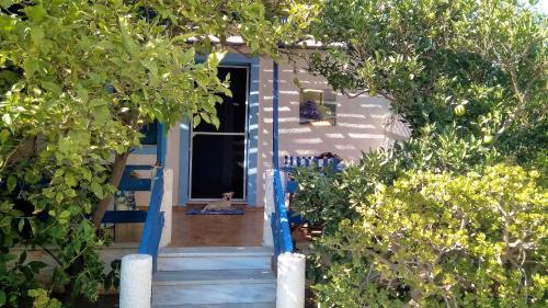 A Cretan house in a garden,overlooking the sea.