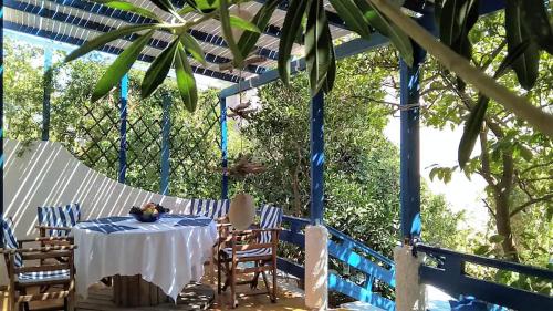 A Cretan house in a garden,overlooking the sea.