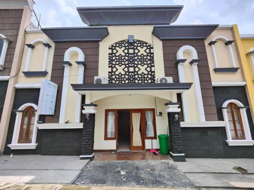 Adiputra Guesthouse HomiQ