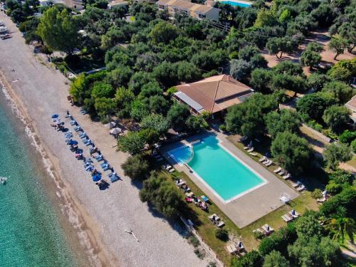 Pebbles and sea at Barbati with shared pool