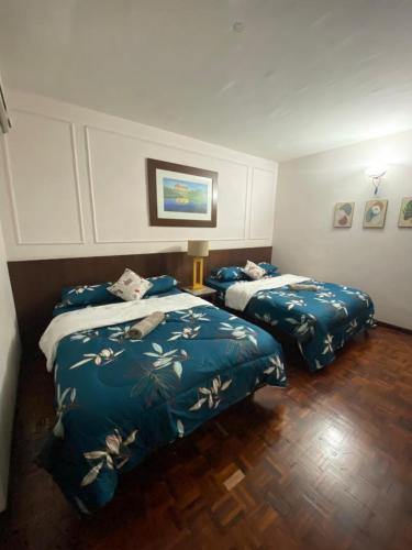 a bed room with two beds and two pillows, D'Sofiya Homestay A Famosa Melaka in Malacca