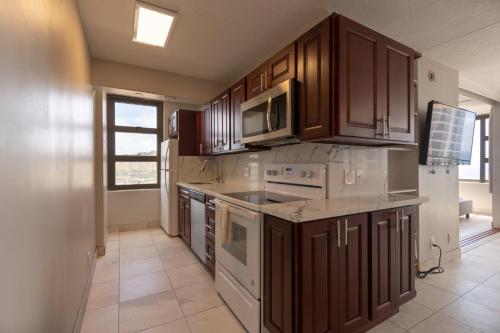 Newly Remodeled Corner Unit at the Waikiki Banyan with Diamond Head Views - main image