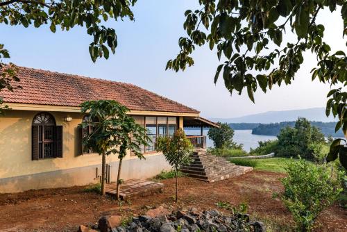 SaffronStays Anantham, Kamshet - pet-friendly lakefront villa with a huge verandah