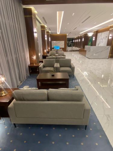 Közös társalgó / TV, منــازل الماسة للشقق المخدومة in Unayzah