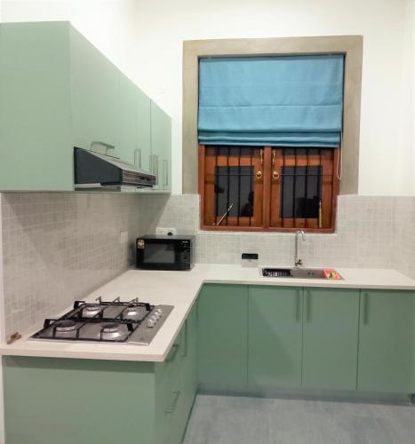 Kitchen, Li's Apartment in Kalalgoda