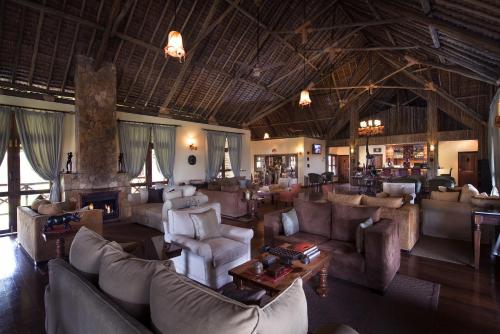 Shared lounge/TV area, Neptune Ngorongoro Luxury Lodge All Inclusive in Ngorongoro
