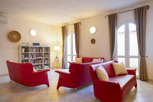 Delt lounge/TV-område, MuMA Hostel in Sant'Antioco