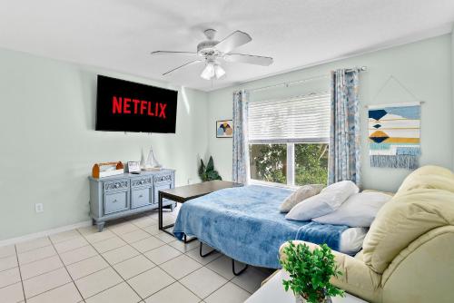 Coconut Cabana - Duplex Delight, Beach-Themed 6BR Retreat with 2 Outdoor Patios & GRILL, Steps from the Sand! in Melbourne, USA