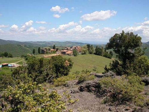 In a wonderful medieval village on the Tuscan hills, with air conditioning