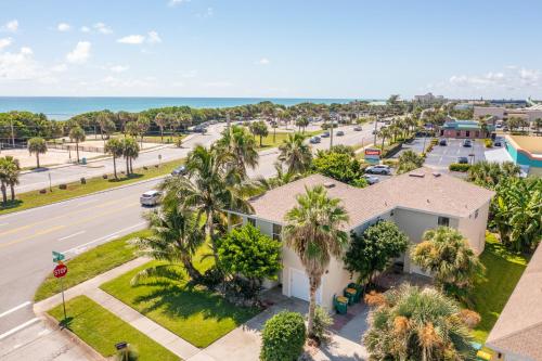 Coconut Cabana - Duplex Delight, Beach-Themed 6BR Retreat with 2 Outdoor Patios & GRILL, Steps from the Sand! in Melbourne, USA