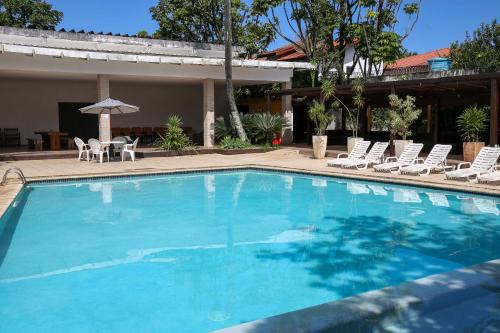 Swimming pool, Delphin Surf Hotel in Guaruja