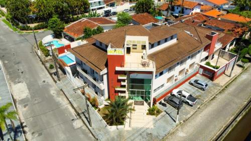 과루자 Hotel Rosa da Ilha Guaruja - 80m do mar, 02 piscinas, sala de jogos, brinquedao de percurso para cri 3성급 호텔 레스토랑