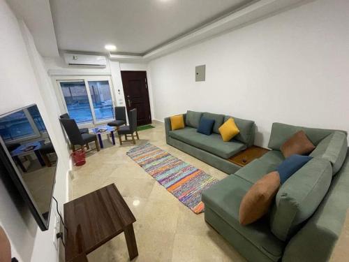 1-Bedroom Apartment with Pool View on the Ground Floor & Shared Infinity Pool on the Roof with Seaview