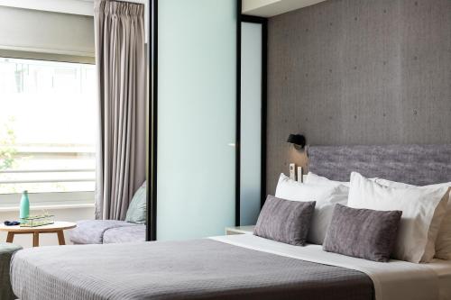 Enattica Suites - Tap to explore photos