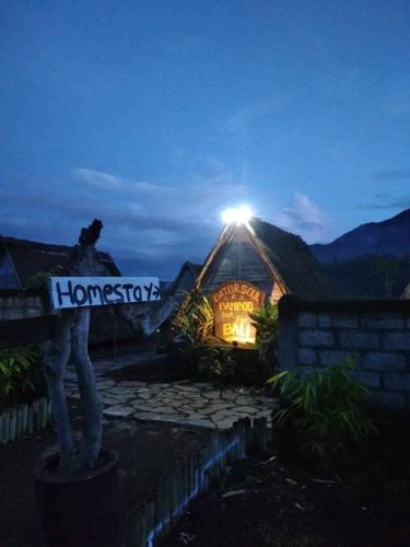 a man standing in front of a fire hydrant, Batur Soul Bambo in Bali