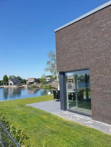 Traum-Ferienhaus mit privatem Seezugang, Sauna, Strand, Wassersport, SUP in Barßel, Deutschland