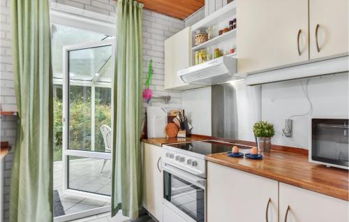 Kitchen, Four-Bedroom Holiday Home In Romo in Romo Kirkeby