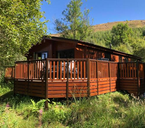 Superior 4 + 2 Person Log Cabin with Hot Tub - No Pets