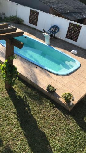 Úszómedence, Apartamento inteiro com piscina em Balneário Pinhal (Apartamento inteiro com piscina em Balneario Pinhal) in Cidreira