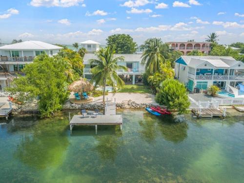 Oceanfront villa with private beach, heated pool, tiki and boat dock