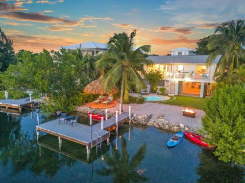 Oceanfront villa with private beach, heated pool, tiki and boat dock