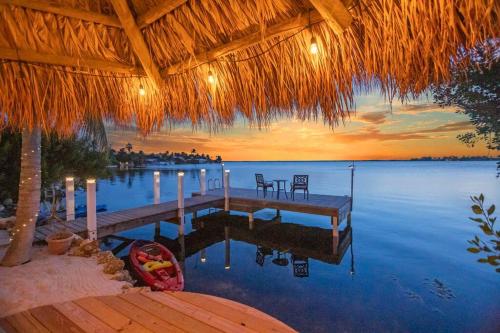 Oceanfront villa with private beach, heated pool, tiki and boat dock