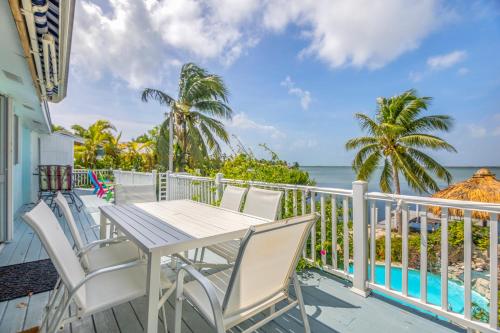 Oceanfront villa with private beach, heated pool, tiki and boat dock