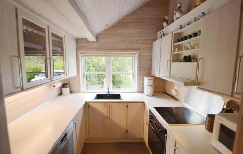 Kitchen, Holiday Home A Hveyselsvej With Shower And Fireplace in Osterby