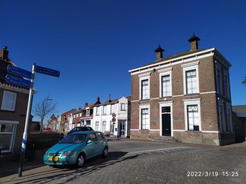 Surrounding environment, The cosy little house with the sundial in Stavenisse