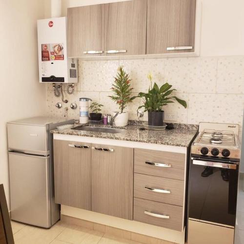 Kitchen, Balcones del Cerro Mono ambiente centrico 2p - camas simples in Villa Carlos Paz