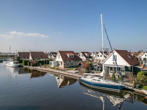  Detached vacation home in Friesland with waterfront views in Grou