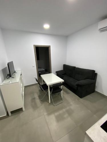 Koplietošanas atpūtas telpa ar TV, APARTAMENTOS PASCUAL in El Cuervo