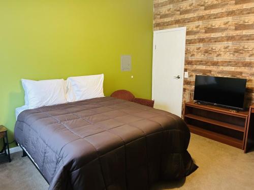 Alcona Suites Private bedroom and Bathroom with shared kitchen and Livingroom