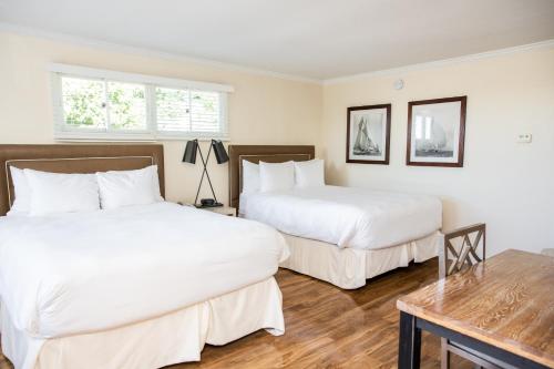 Three Village Inn Room Type - Queen Room with Two Queen Beds