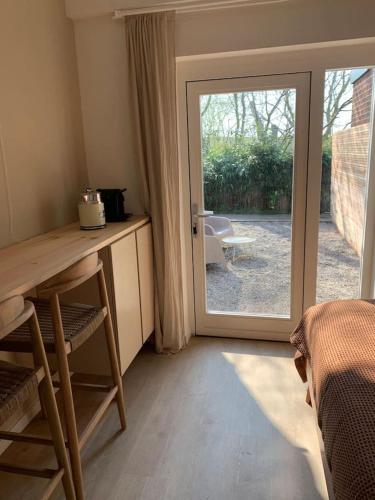  Guest room with terrace at the Wadden Sea in Oosterend