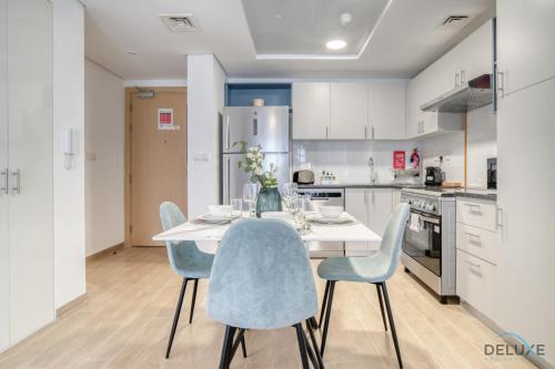 Kitchen, Serene 2BR at The Nook Wasl Gate Jebel Ali by Deluxe Holiday Homes near Gurunanak Darbar Sikh Temple