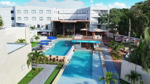 Two pools in front of a white building at the Dreamer hostel and hotel in San Andres Colombia