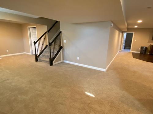 Private basement bedroom with private bathroom, kitchen, and living room with large screen televisio in Fishers