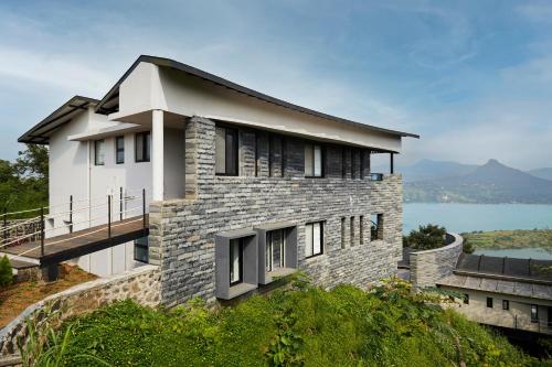 Exterior view, SaffronStays Ahilya Waters - 3BR Pawna villa, infinity pool, 270 terrace views, bonfire & AD-feature in Kolechafesar
