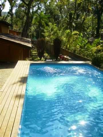 Casa na praia de Camburi em condomínio com piscina aquecida