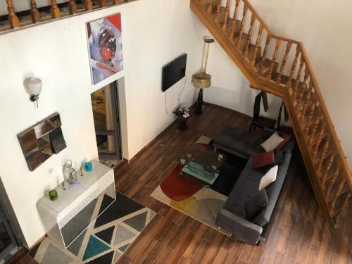 Koplietošanas atpūtas telpa ar TV, BELLE VILLA PROCHE BORD DE MER in Ngaparou