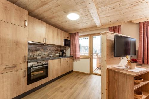 virtuve, Pircherhof Appartements in Haus im Ennštāla